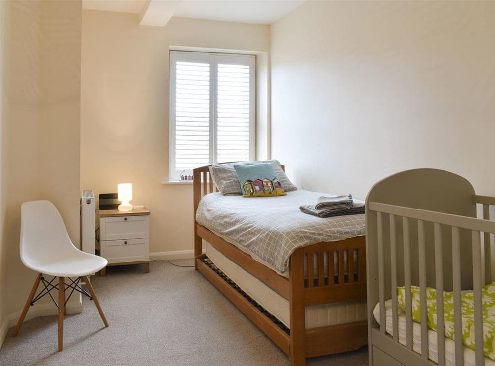 Airy single bedroom with pull out bed and cot at Flowergate House in Whitby, North Yorkshire