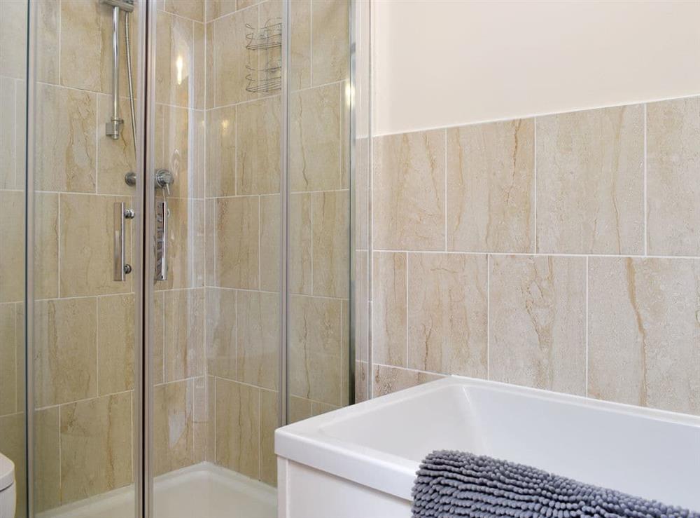 Family bathroom with bath and separate shower cubicle at Flowergate House in Whitby, North Yorkshire