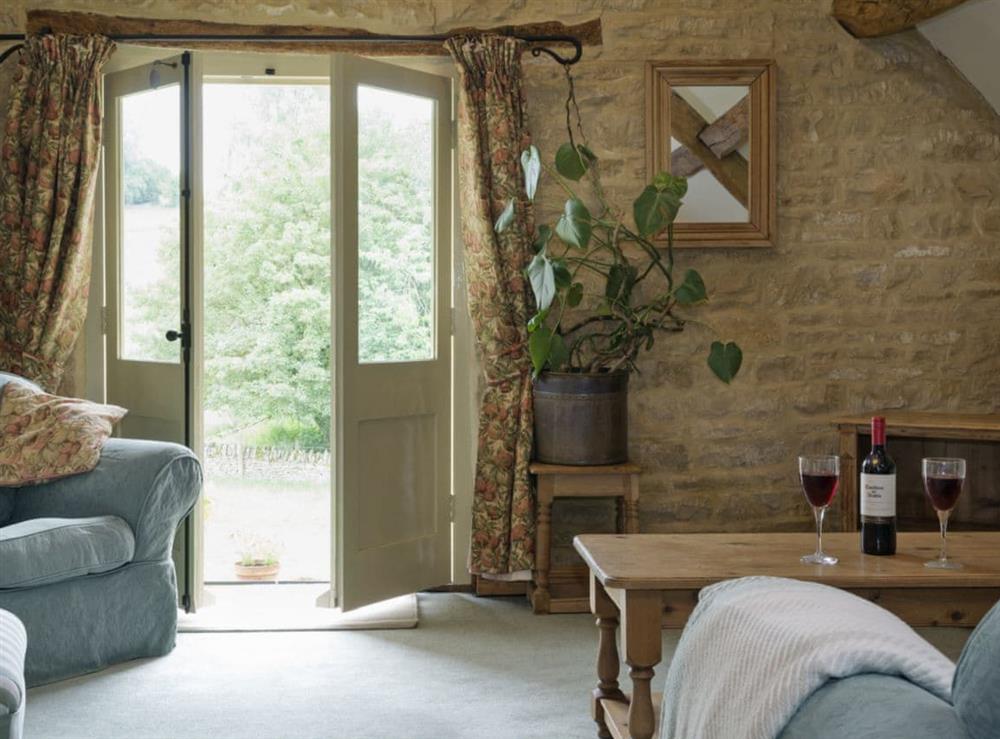 Cosy living room area at Flowers Barn in Middle Duntisbourne, near Cirencester, Gloucestershire