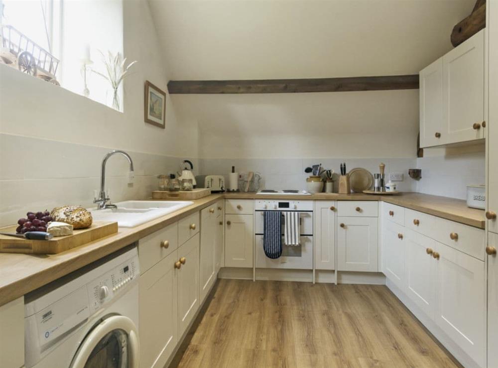 Immaculately presented kitchen at Flowers Barn in Middle Duntisbourne, near Cirencester, Gloucestershire