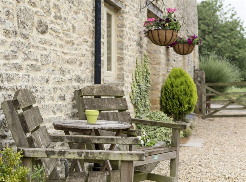 Sitting out area at Flowers Barn in Middle Duntisbourne, near Cirencester, Gloucestershire