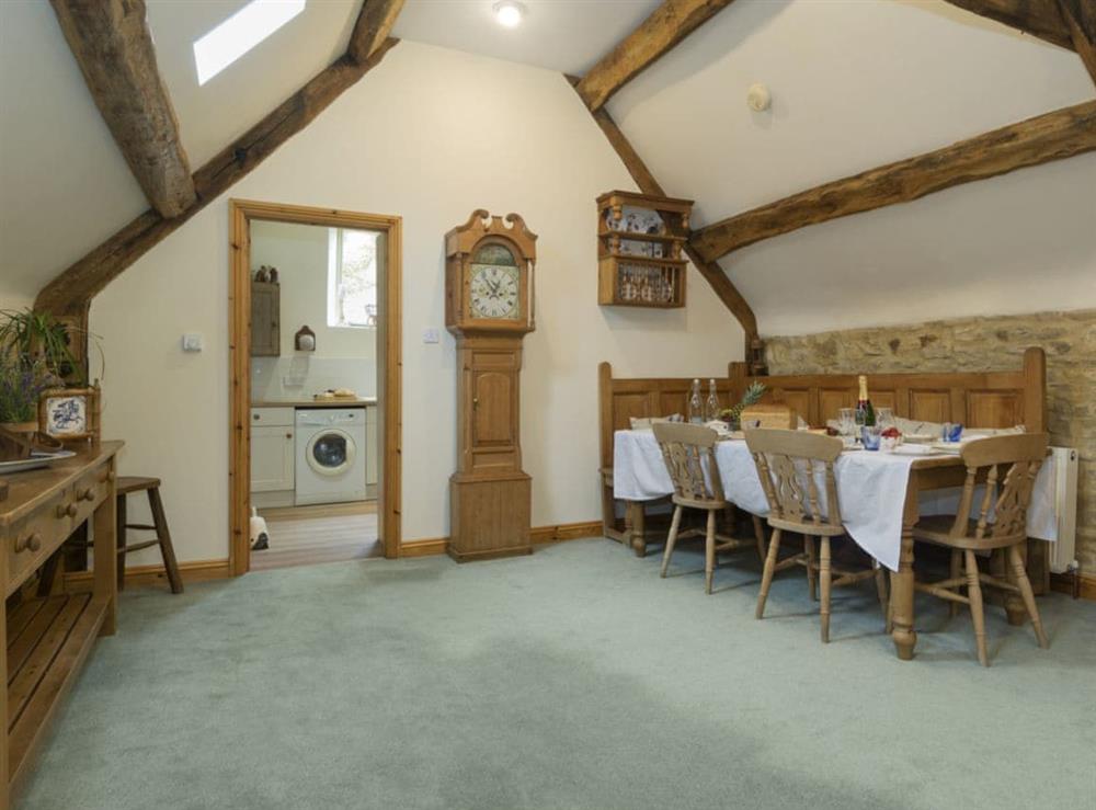 Spacious dining area at Flowers Barn in Middle Duntisbourne, near Cirencester, Gloucestershire