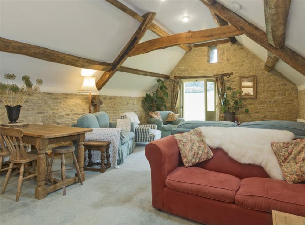 Thoughtfully renovated living/dining room (photo 3) at Flowers Barn in Middle Duntisbourne, near Cirencester, Gloucestershire