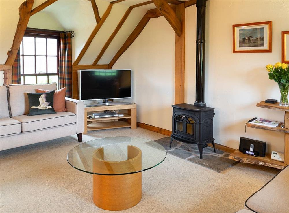 Living room with wood burner (photo 2) at Fochy Cottage in Kinross, Nr Perth., Kinross-Shire