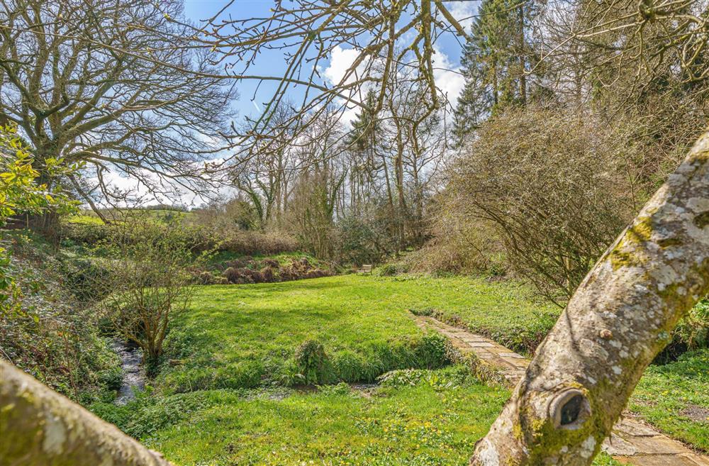 The large garden is perfect for exploring at Ford Cottage, Corscombe