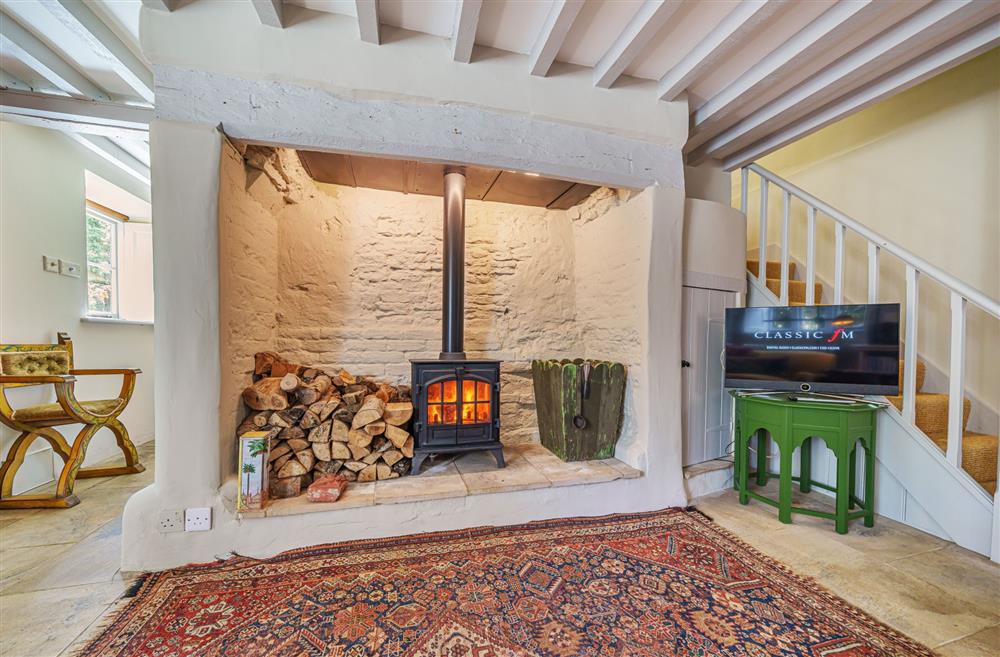 The wood burning stove is ideal for cosy nights in at Ford Cottage, Corscombe