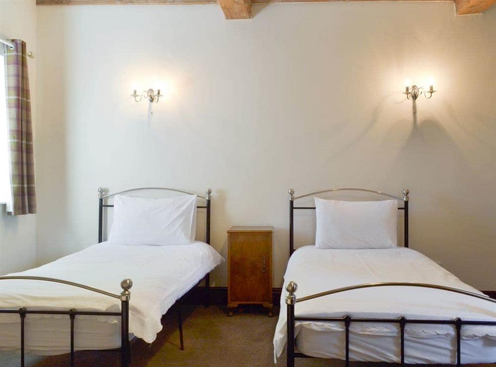 Good-sized twin bedroom at Foremark Threshing Barn, 