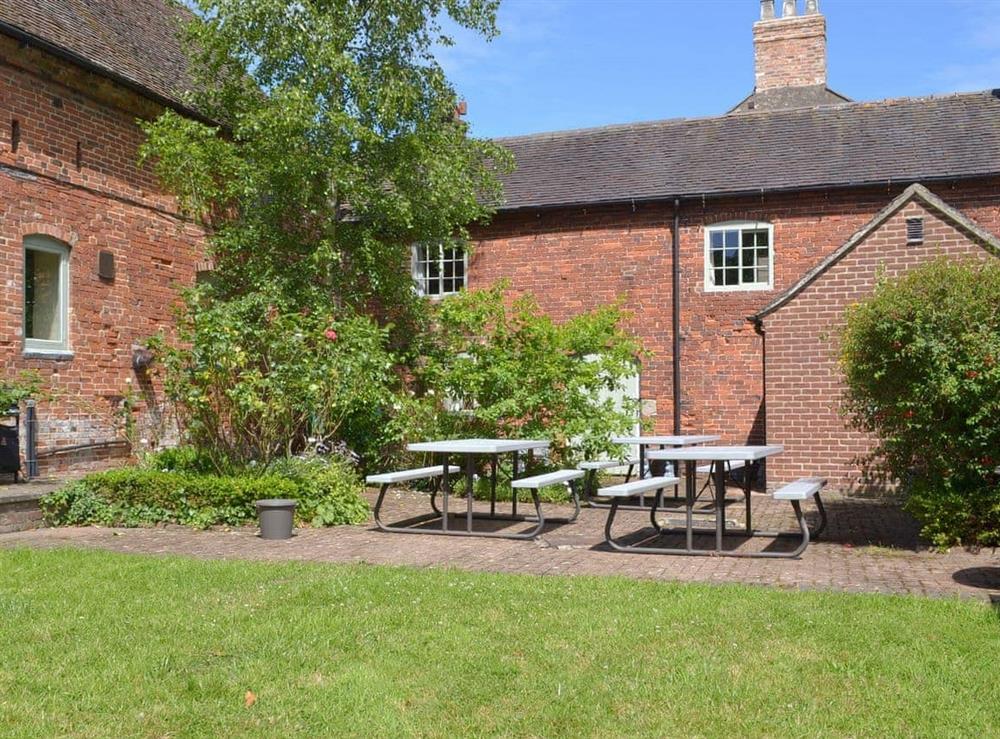 Shared patio area with outdoor furniture at Foremark Threshing Barn, 