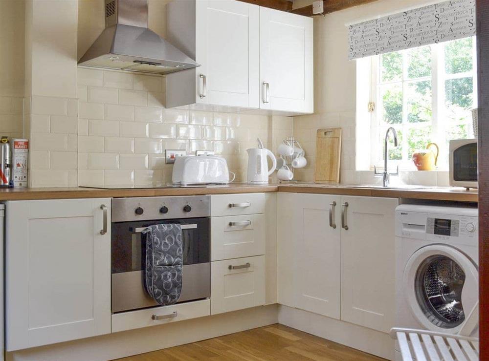 Well-equipped fitted kitchen at Repton Cottage, 