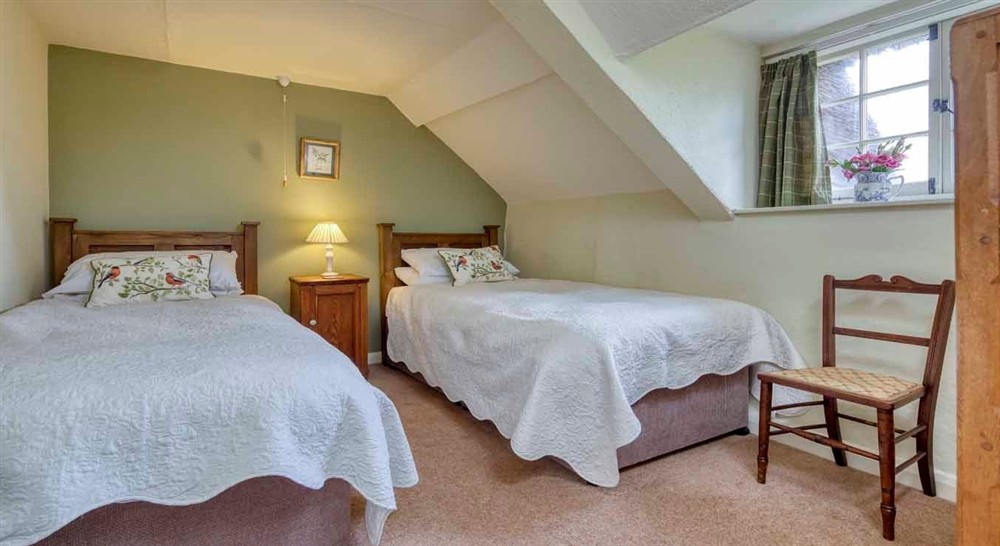 One of the twin bedrooms at Forest Cottage in Exeter, Devon