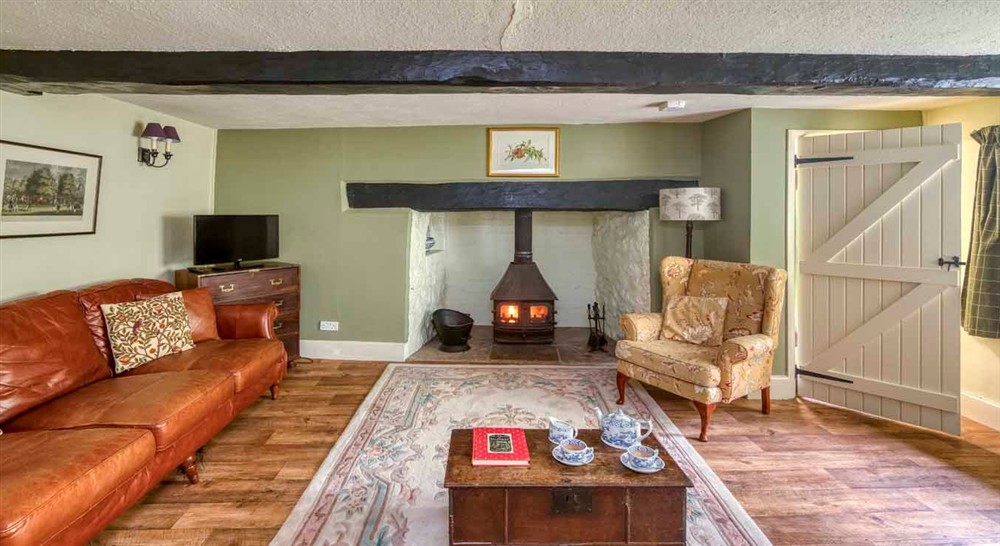 The cosy sitting room at Forest Cottage in Exeter, Devon