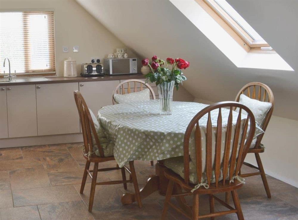 Cosy kitchen/dining area at Forest Cottage in Northwold, Norfolk