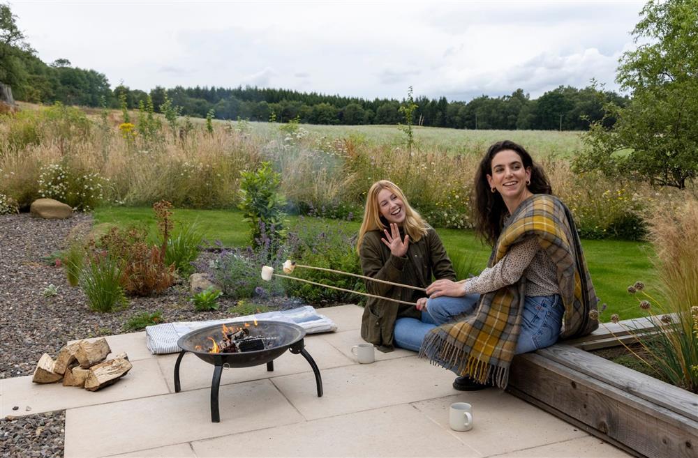 People sitting around the fire pit