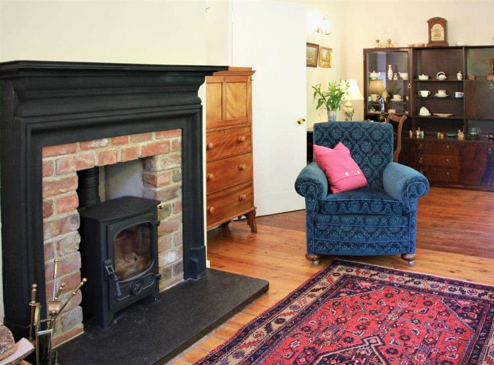 Cosy living area with wood burner at Foresters Cottage in Tarbat, Invergordon, Ross-Shire