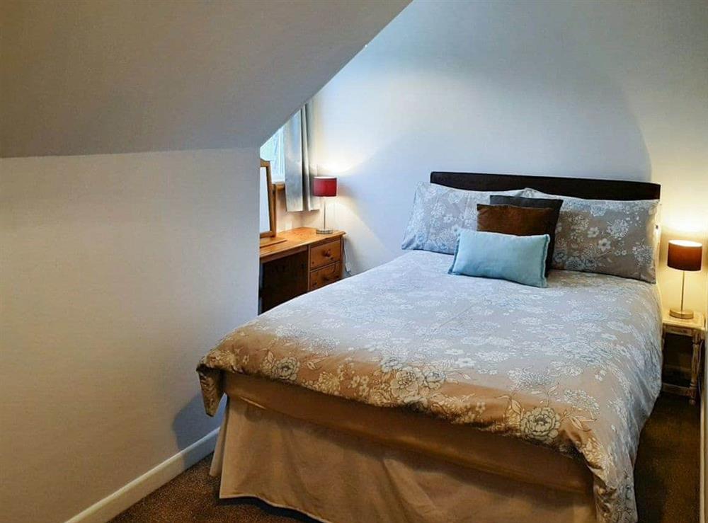 Welcoming bedroom with double bed at Forge Cottage in Shaldon, Devon