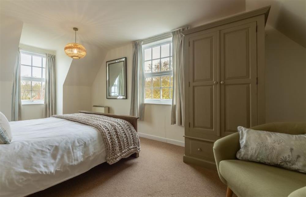 First floor:  Master bedroom with dual aspect at Forge Cottage, Thornham near Hunstanton