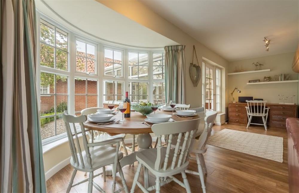 Ground floor: Dining area with feature bay window at Forge Cottage, Thornham near Hunstanton