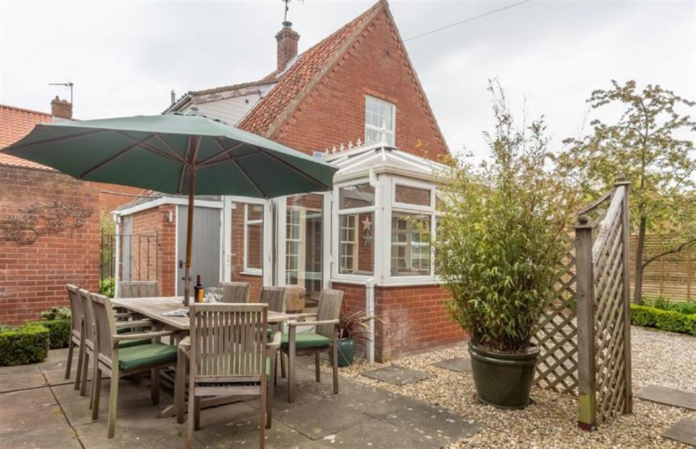 Side garden:  Full enclosed paved area at Forge Cottage, Thornham near Hunstanton