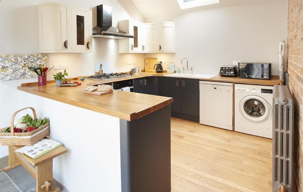Spacious kitchen, well equipped with plenty of natural light from the skylight above at Forge Croft, Skirpenbeck 