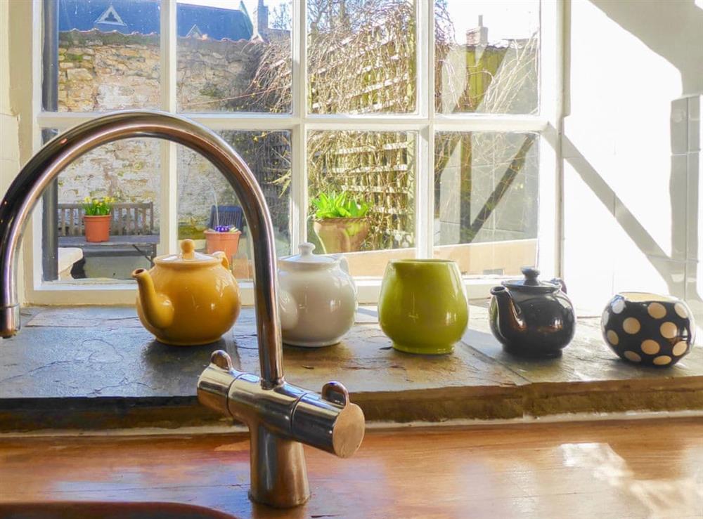 Delightful sunny kitchen overlooking the courtyard garden at Forge View Cottage in Thornton-le-Dale, near Pickering, North Yorkshire
