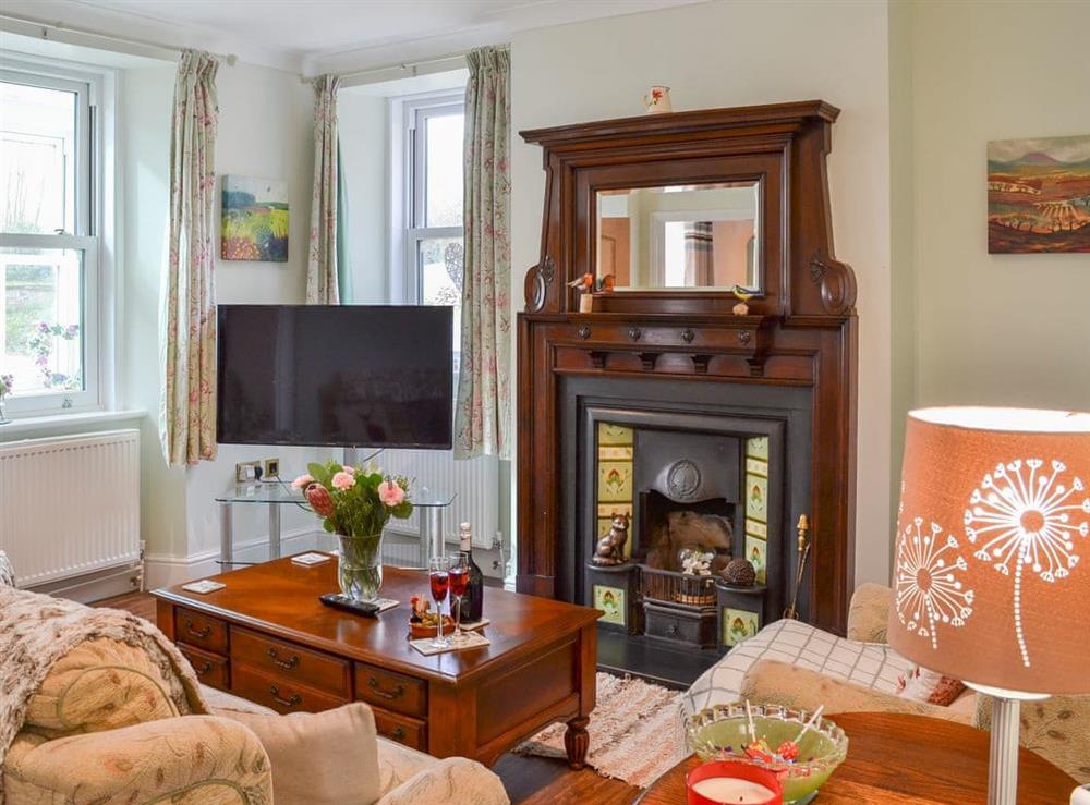 Comfortable living room with large fireplace at Forge Villa in Ebberston, near Pickering, North Yorkshire