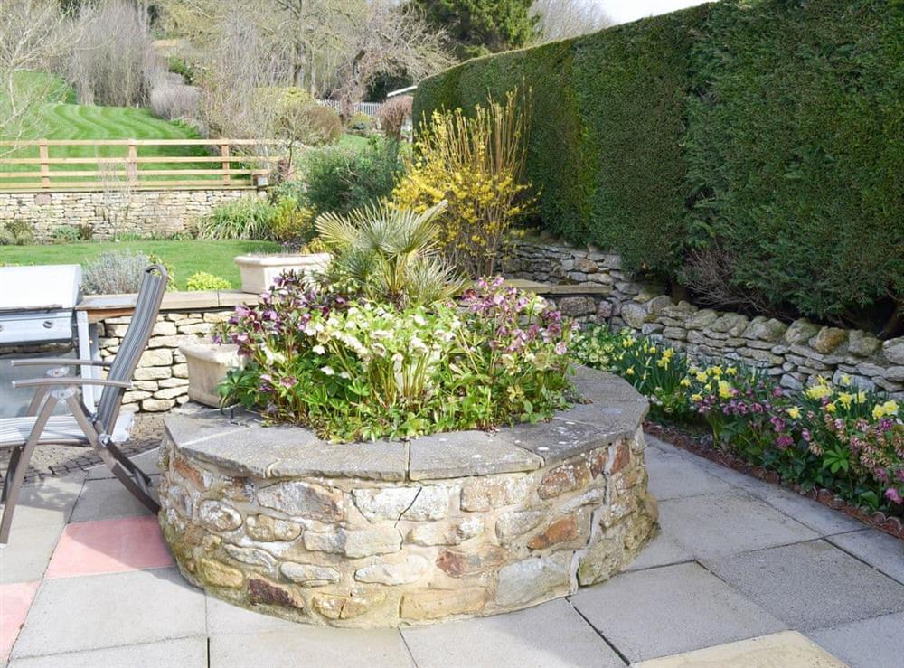 Lovely patio with attractive planting at Forge Villa in Ebberston, near Pickering, North Yorkshire