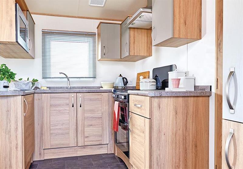 The kitchen area in a Cheviot Deluxe Caravan at Forget Me Not Country Park in Long Horsley, Northumberland