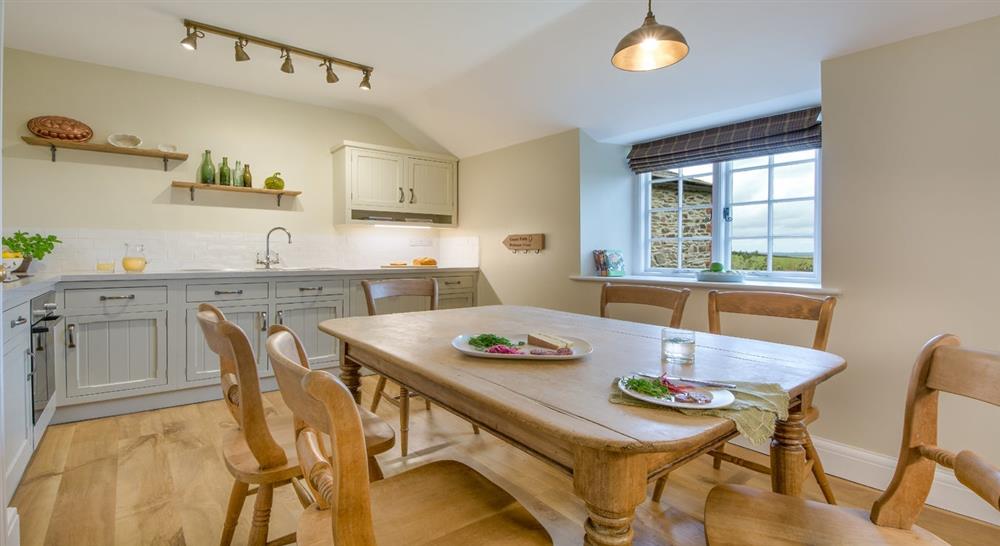The dining and kitchen area at Fortescue in Lanteglos-by-fowey, Cornwall