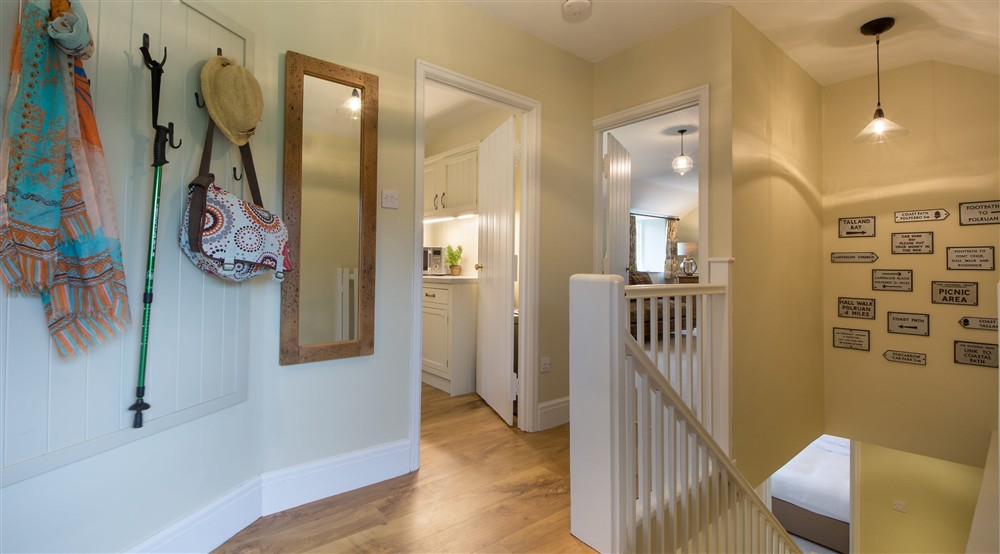The entrance hallway with hooks to hang coats and bags at Fortescue in Lanteglos-by-fowey, Cornwall