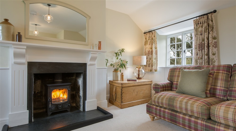 The sitting room with multifuel stove at Fortescue in Lanteglos-by-fowey, Cornwall