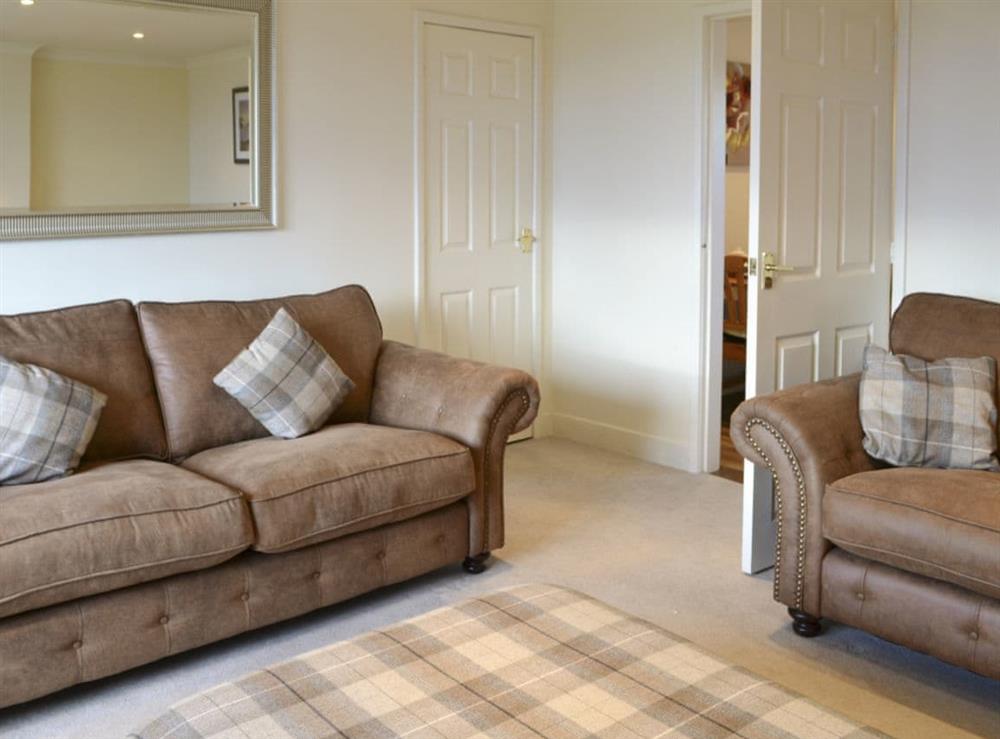 Comfy seating in living room at Foulden Hill Farm Cottage in Berwick-Upon-Tweed, Northumberland