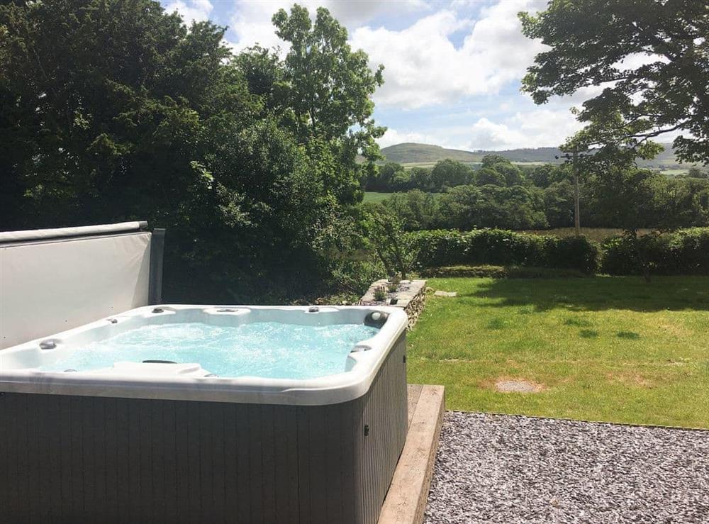 Relaxing hot tub overlooking garden at Fountain Hill in Eglwyswrw, near Cardigan, Pembrokeshire, Dyfed