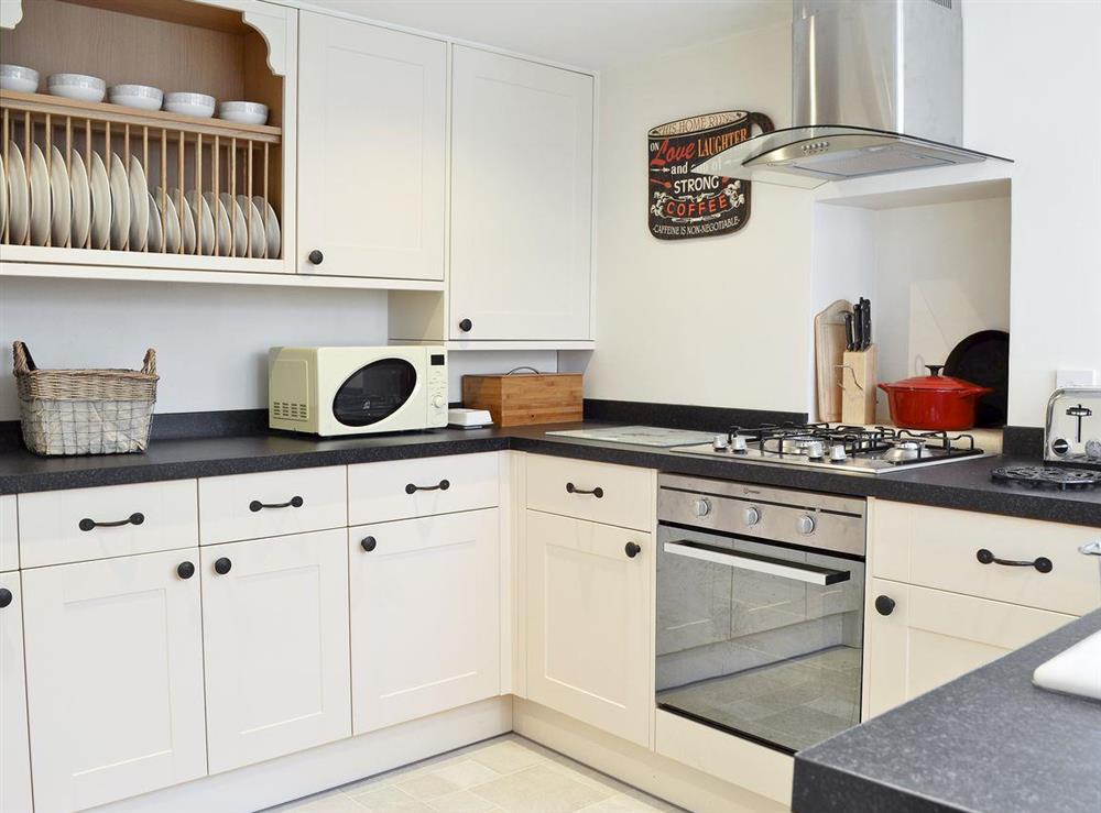 Modern kitchen with electric oven, gas hob, microwave, fridge/freezer, dishwasher and washing machine at Four Seasons in Pickering, North Yorkshire