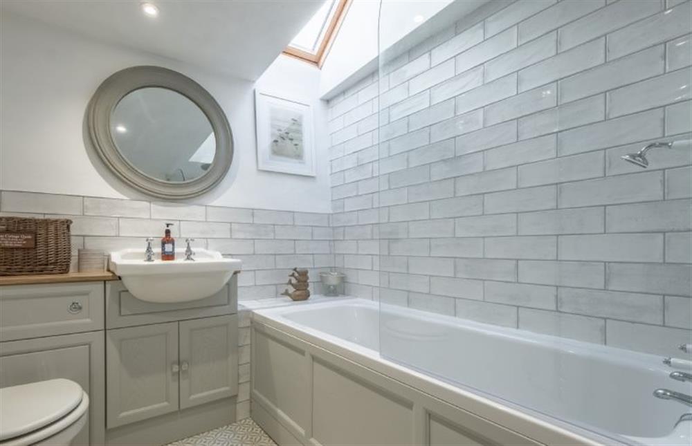 First floor: Bathroom with bath and overhead shower at Fox Cottage, South Creake near Fakenham