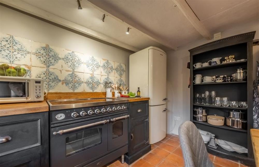 Ground floor: Kitchen with an electric range cooker and fridge/freezer at Fox Cottage, South Creake near Fakenham