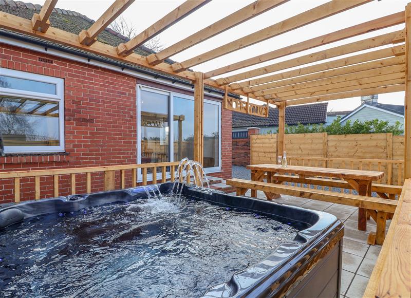 Spend some time in the hot tub at Fox Retreat, Sherburn