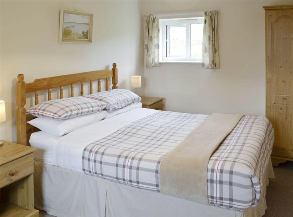 Relaxing double bedroom at Foxglove Cottage in Wootton Fitzpaine, near Charmouth, Dorset