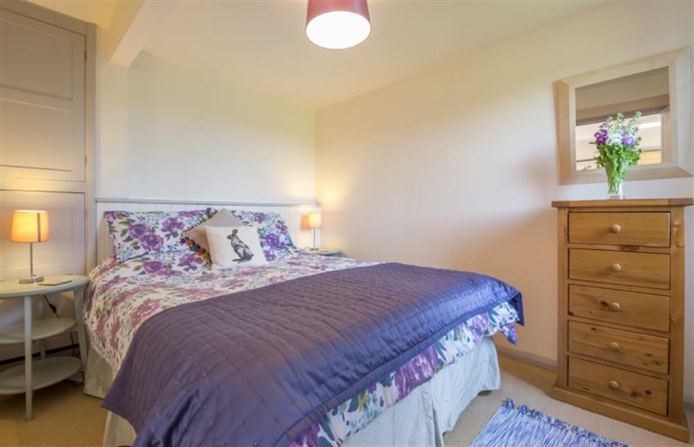 Ground floor:  Bedroom with king-size bed at Foxglove, Houghton near Kings Lynn