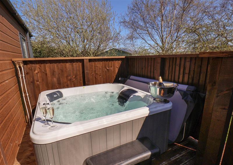 Relax in the hot tub at Foxglove Lodge, Runswick Bay near Staithes