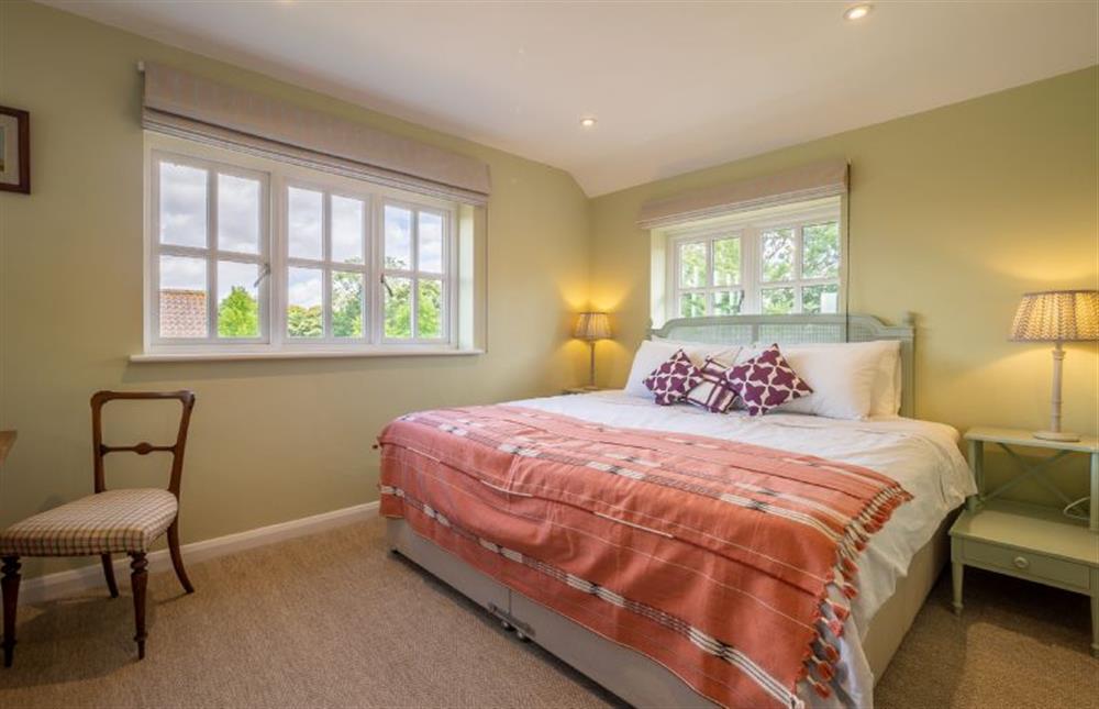 Bedroom two has a super-king size zip-and-link bed at Foxhole Cottage, Framsden
