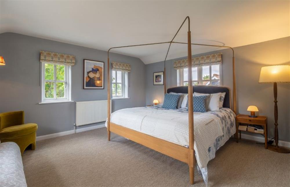 The master bedroom has a luxurious super-king size bed at Foxhole Cottage, Framsden