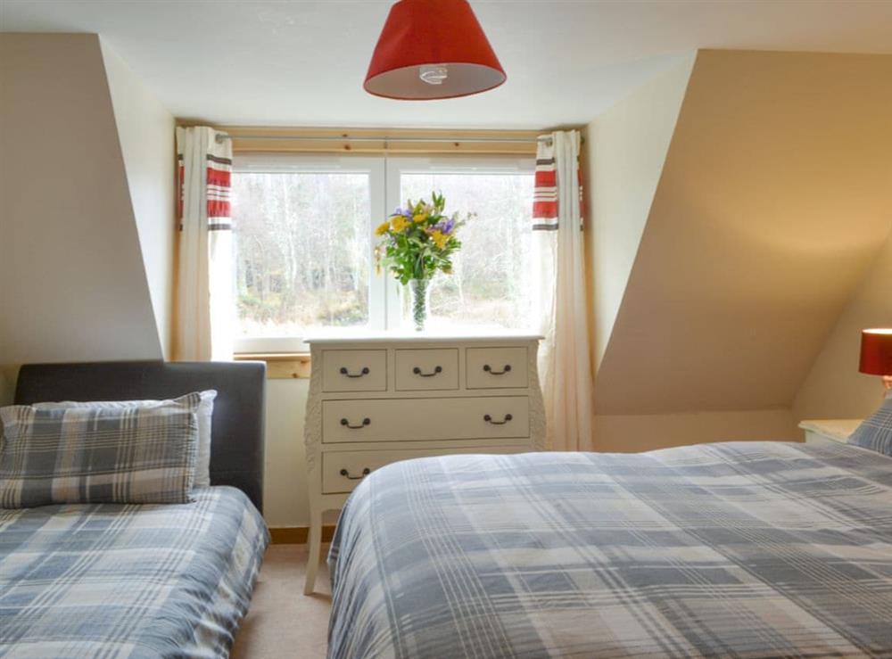 Useful en-suite family bedroom with a double and a single bed at Foxhole Farm Cottage in Beauly, Inverness-Shire