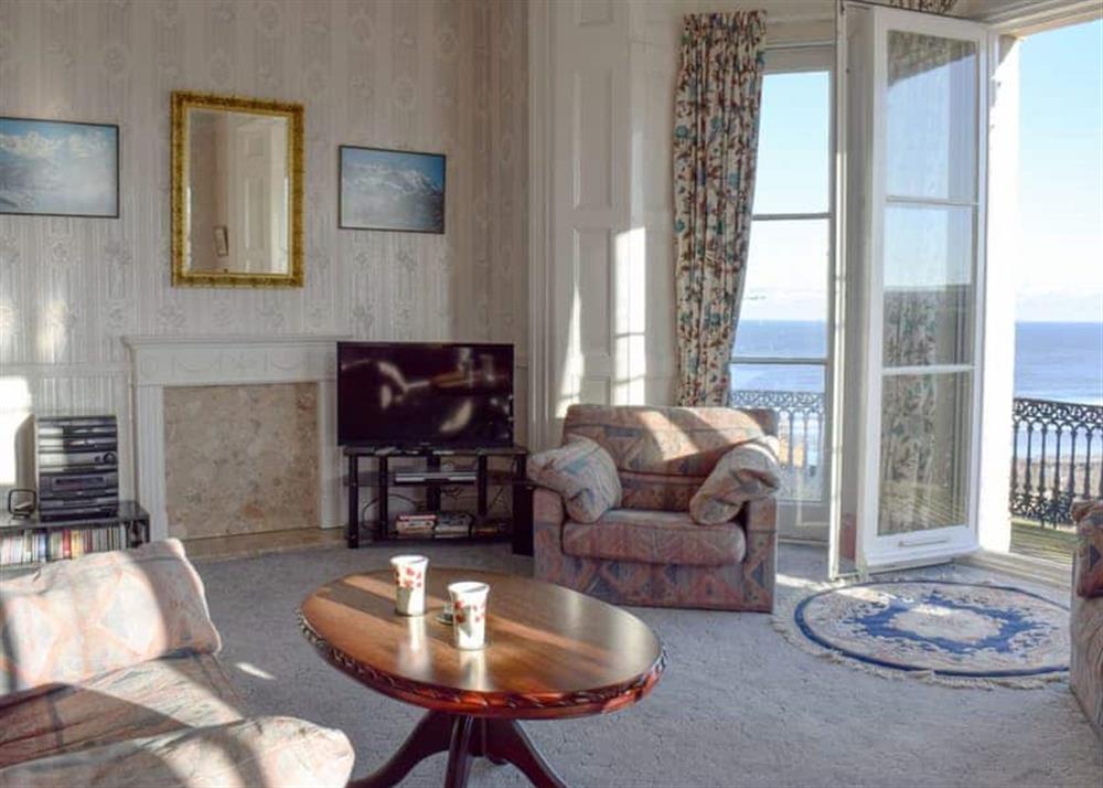 Comfortable living room with doors leading onto the balcony at Franks View in Saltburn-by-the-Sea, Yorkshire, Cleveland