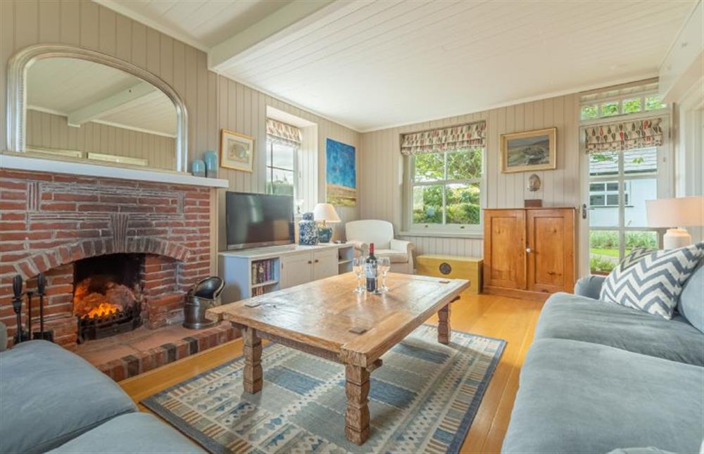 Ground floor:  Sitting room with feature open fireplace