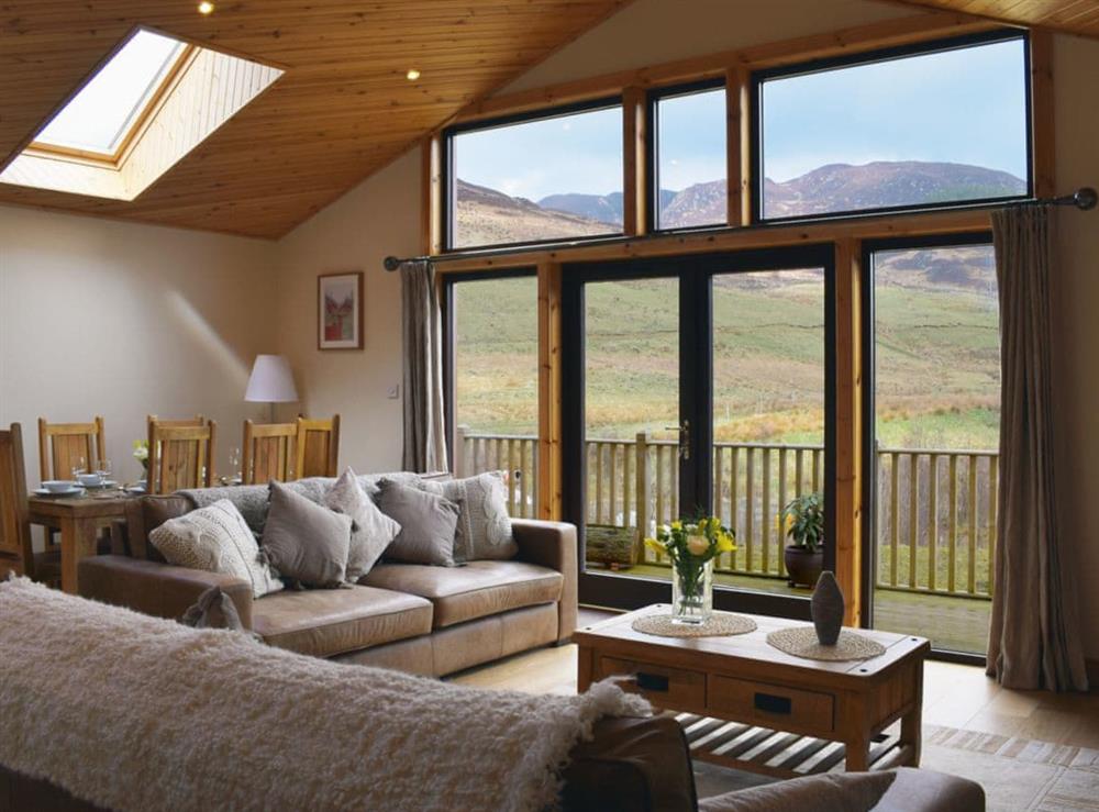 Open plan living space with floor to ceiling windows to take advantage of the stunning surrounding area at Frith View in Glengoulandie, near Aberfeldy, Perthshire