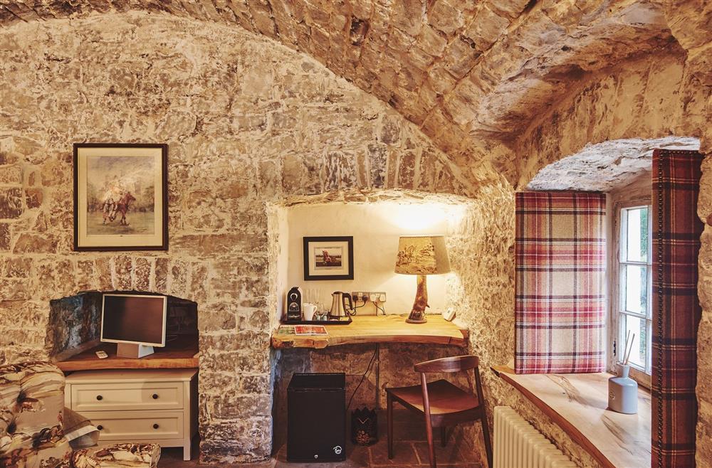 The desk area and exposed brick walls