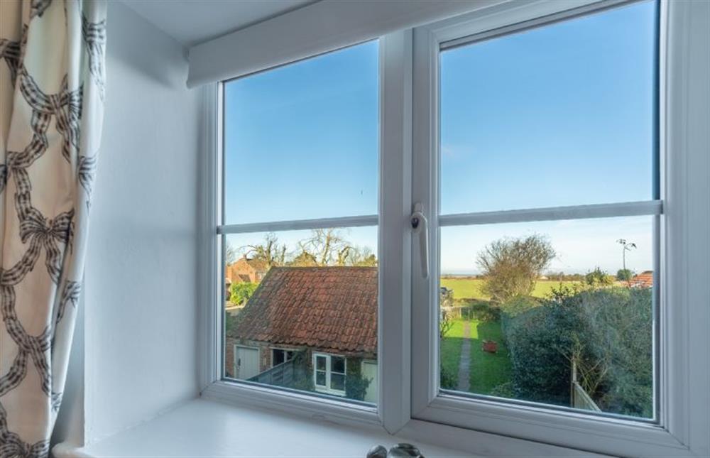 First floor: Bedroom two with views across the marshes (photo 2) at Froggy Cottage, Thornham near Hunstanton