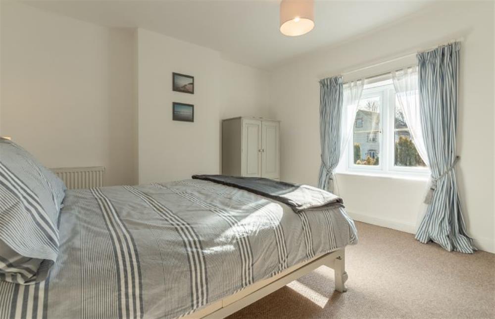 First floor: Master bedroom with window to the front of the property at Froggy Cottage, Thornham near Hunstanton