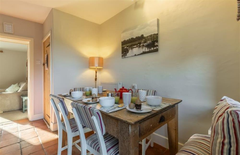 Ground floor: Dining area leading through to the sitting area at Froggy Cottage, Thornham near Hunstanton