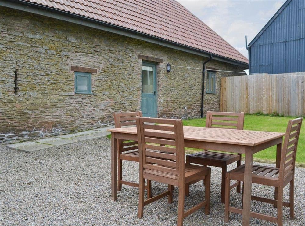 Gravelled patio area with outdoor furniture